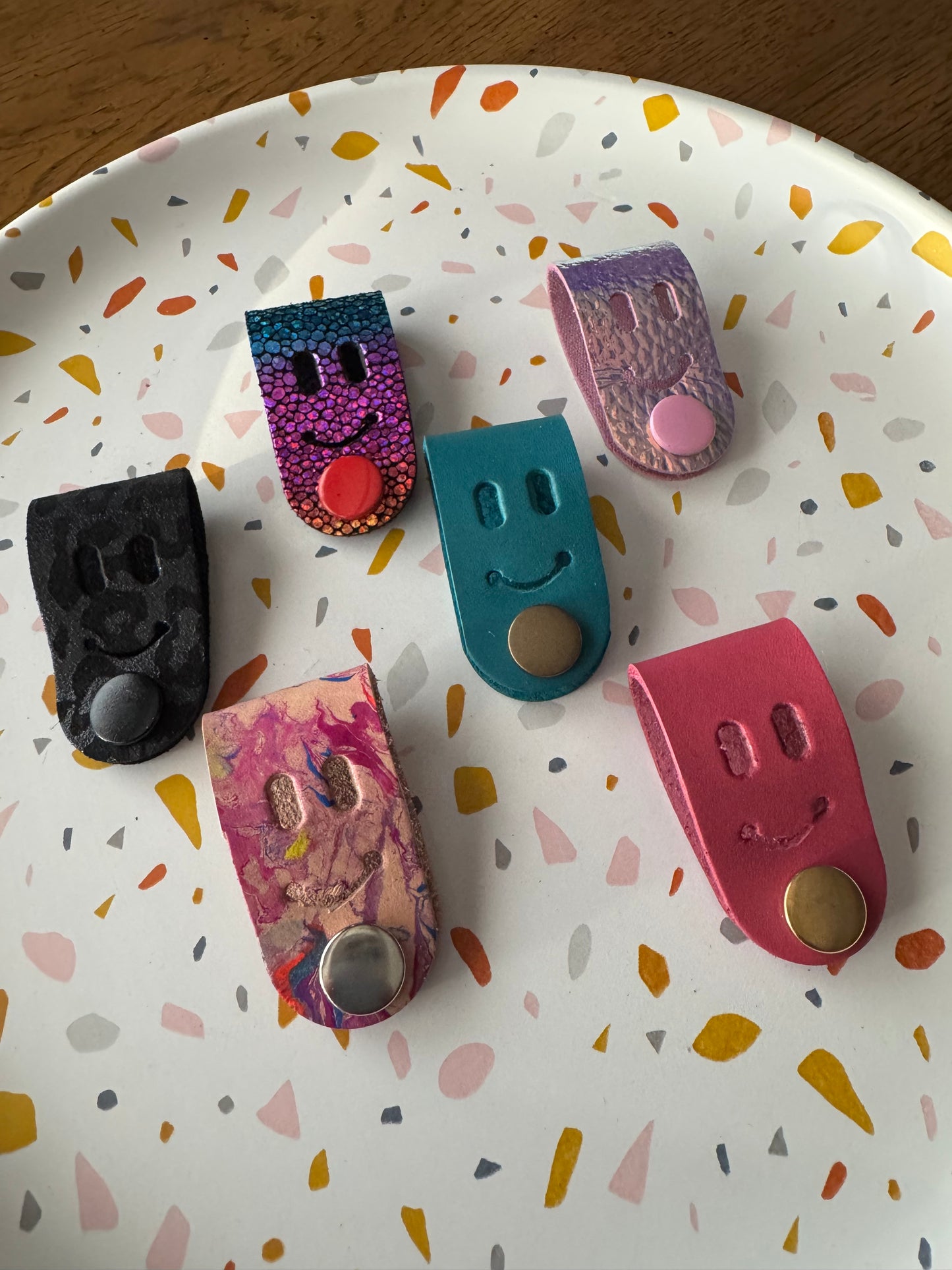 Cord creepers!! (Keepers) Happy smiley face leather strap charms!