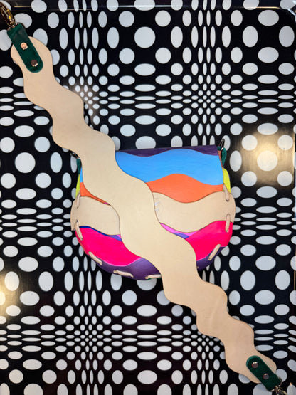 Colorful handbag with a polka dot pattern in the background