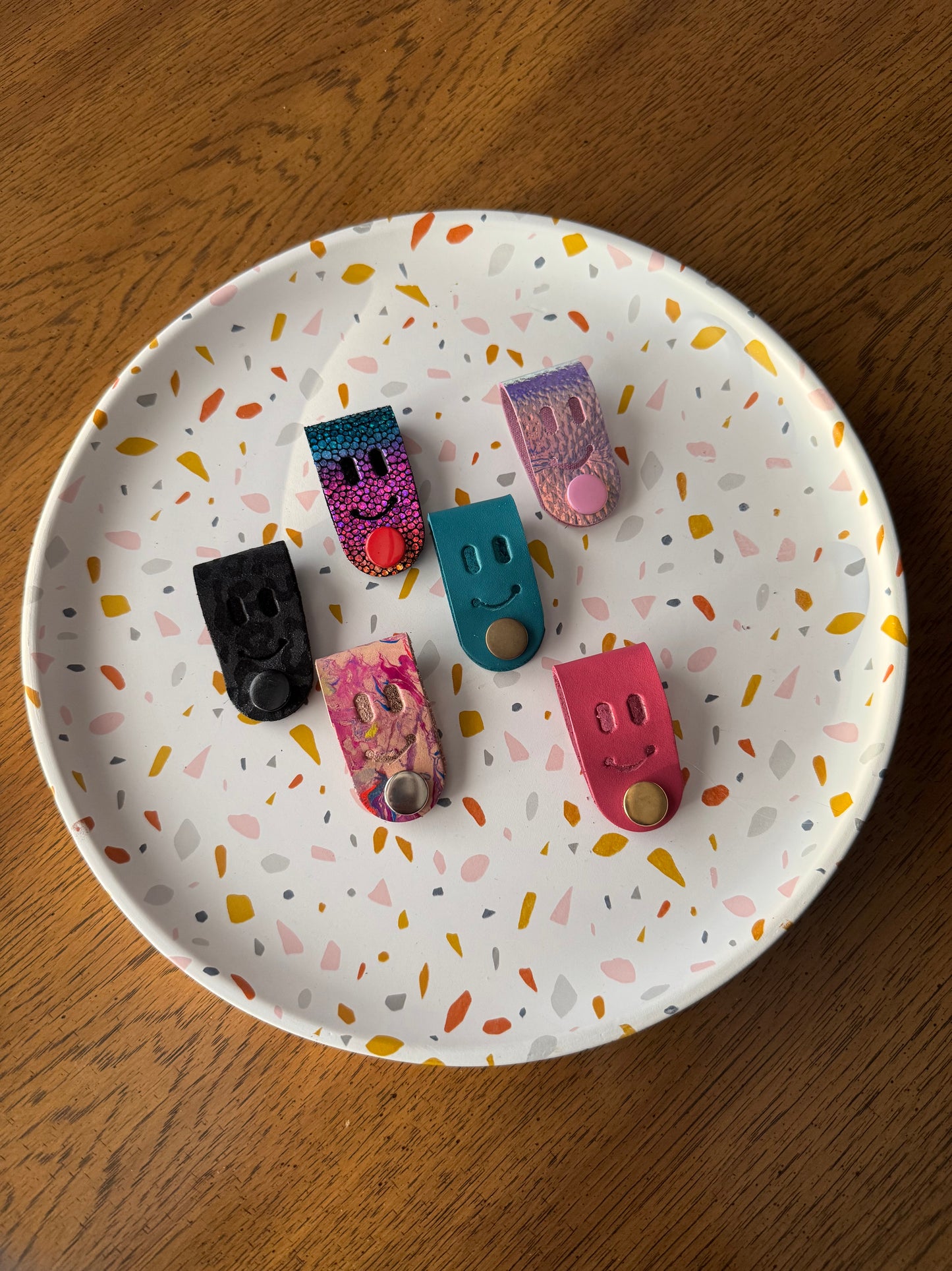 Cord creepers!! (Keepers) Happy smiley face leather strap charms!